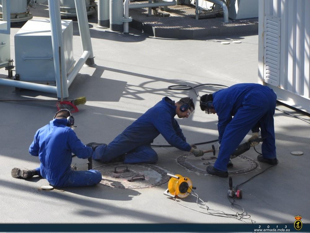 Crew members carrying out maintenance works.