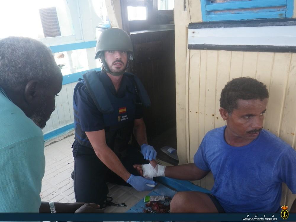 Medical personnel from the ‘Relámpago’ assisting one of the fishermen