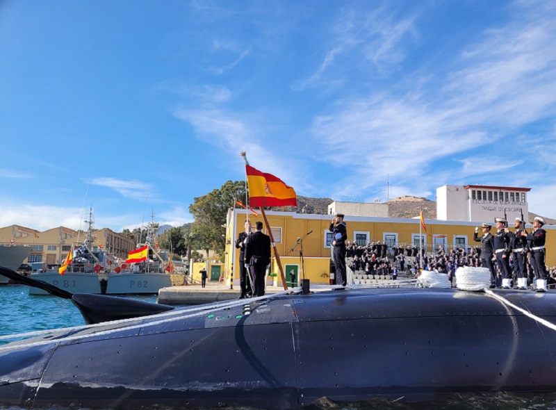 Hoisting the Spanish flag on the submarine.